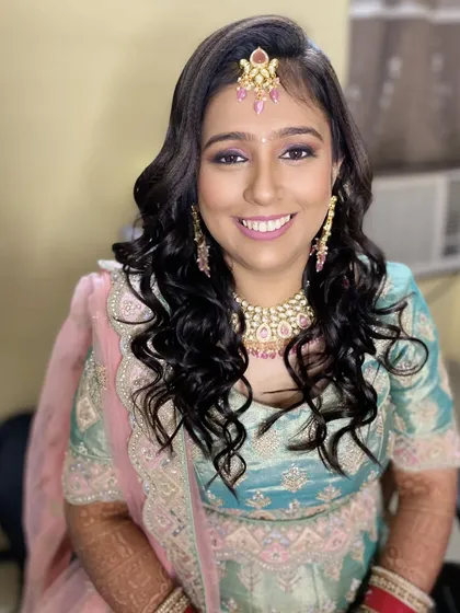 A happy smile from my reception bride. The makeup is designed to be both beautiful and long-lasting, perfect for a night of celebrating.