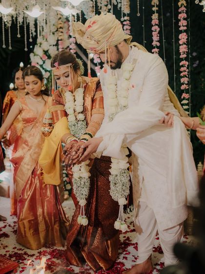 Another angle of the sacred homa ritual, showing the couple's focused participation and the traditional elements of the ceremony.