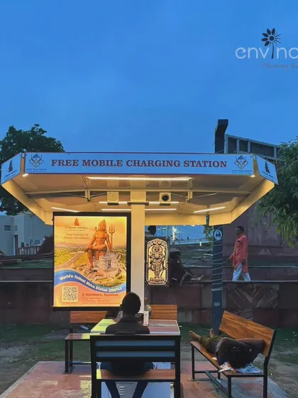 A person rests under the shelter of our solar hut during the evening. The ambient lighting and charging facilities make it a popular spot for locals and tourists to unwind.