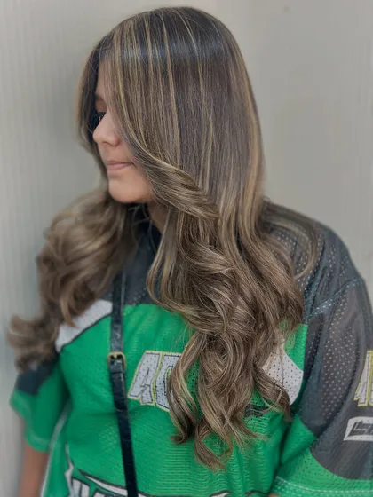 A closer look at the beautiful blend of tones in this balayage. The highlights are placed to create a natural, sun kissed effect.