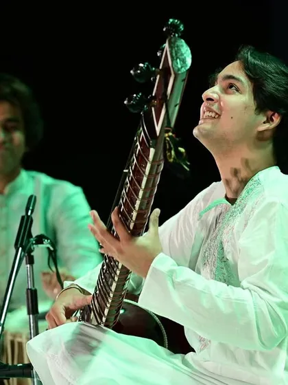 A smile of gratitude towards the audience and my fellow artist, Ramendra Solanki bhai, on stage in Aurangabad. The chemistry between musicians is everything.