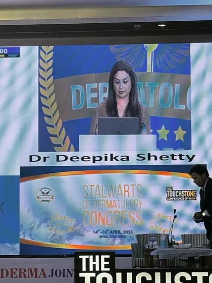 My presentation on the main screen at the dermatology congress. It's a humbling experience to share my work on such a prominent platform.