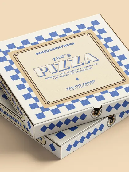 Even my pizza boxes are designed with a touch of French flair. This checkered blue and white design brings a bit of Parisian style to your takeaway order.