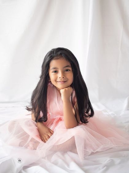 A simple, beautiful portrait for her fifth birthday. Her direct gaze and sweet smile make this a timeless keepsake.
