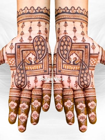 The same peacock frame design against a feathered white background, giving it an ethereal feel.