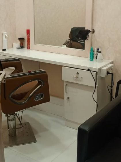 Another view of my clean and well-equipped styling area. I have everything needed to provide a professional hair replacement service in a comfortable setting.