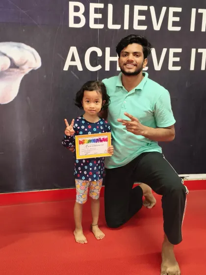 That winning smile says it all. Receiving a certificate from a coach is a special moment that we make sure to capture for every one of our gymnasts.