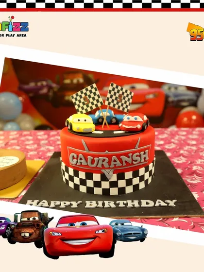 The centerpiece of the Cars party was this incredible cake. It features a checkered flag design and edible car toppers, perfectly matching the high-speed theme.