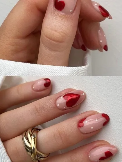 A playful and romantic Valentine's design. This sheer polka-dot manicure is accented with 3D metallic red hearts.