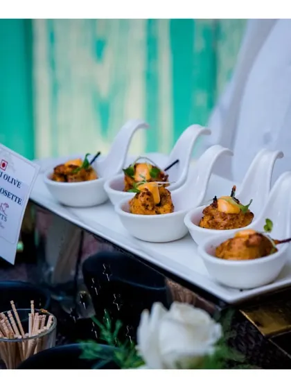 Peri Peri Chicken Rosette served in elegant ceramic spoons. This one bite appetizer is packed with flavour and demonstrates our flair for international cuisine.
