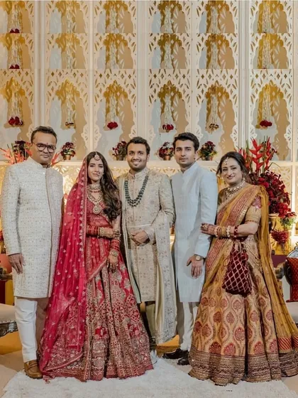 For Pranavi and Labhya's wedding, our family styling complemented the couple's refined heritage charm. This group portrait showcases the harmonious coordination of rich fabrics and subtle embellishments, creating a timeless look that radiates grace and unity.