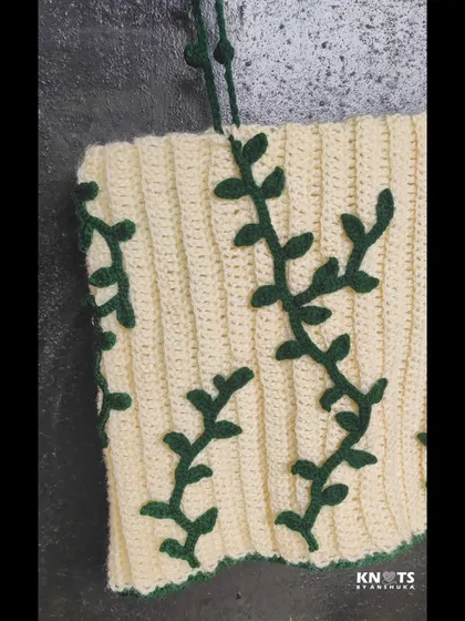 Another look at the ivy top, showing how the vines crawl across the fabric. The straps have these cute little bobble details too.
