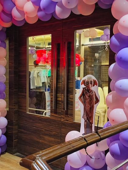 A Dobby cutout greets guests as they enter the Harry Potter party, a small detail that fans of the series will appreciate.