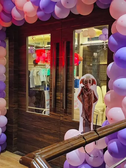 A Dobby cutout greets guests as they enter the Harry Potter party, a small detail that fans of the series will appreciate.
