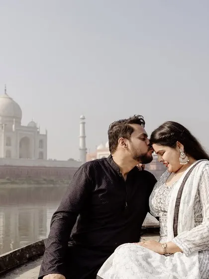 An intimate moment on a boat with the Taj Mahal softly reflected in the Yamuna river. This is the kind of iconic, romantic destination shot I love to create, capturing a classic symbol of love in a unique and personal way.