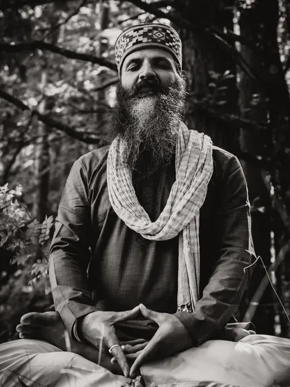 Shift your energy from worrying about what you cannot control to focusing on what you can create. This black and white photo captures a moment of deep meditation, where creation begins.