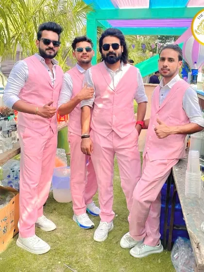 Pretty in pink. For this daytime event, our team wore matching pink suits and vests, adding a pop of color and style to the bar area.