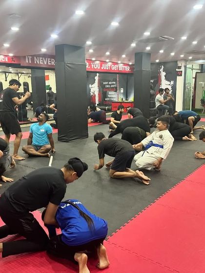 A full view of our BJJ class during a drill session. Students of all levels practice together, creating a supportive atmosphere where everyone can learn and improve.