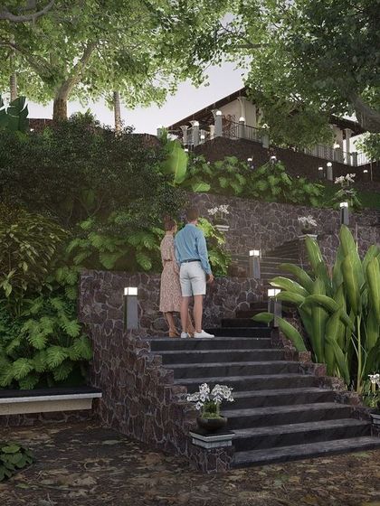 To make the steep backyard of the Nilaya Residence accessible, I designed a series of tiered levels connected by stone stairways. This practical solution also creates a visually appealing journey down to intimate seating areas nestled in the lush landscape.