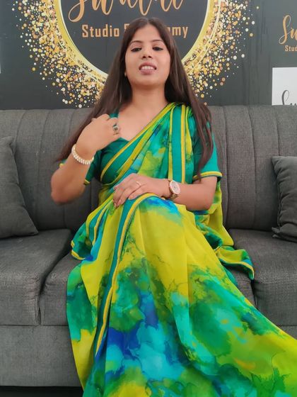 Taking a moment to talk to my students. I love wearing bright, cheerful sarees when I teach.