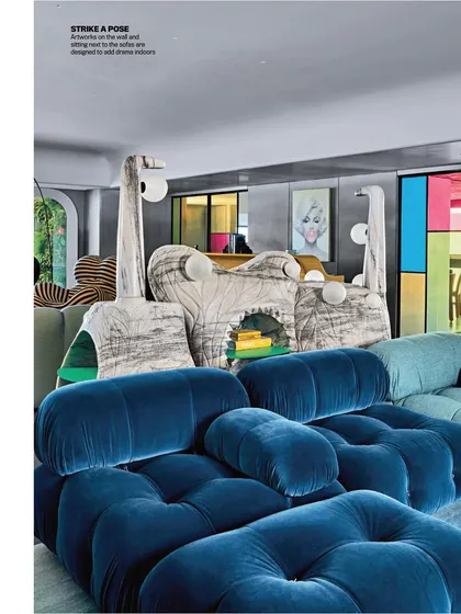 A shot from the India Today Home feature, showing the Monster Console and the plush blue velvet sofa. This angle highlights how the different sculptural forms and textures play off each other.