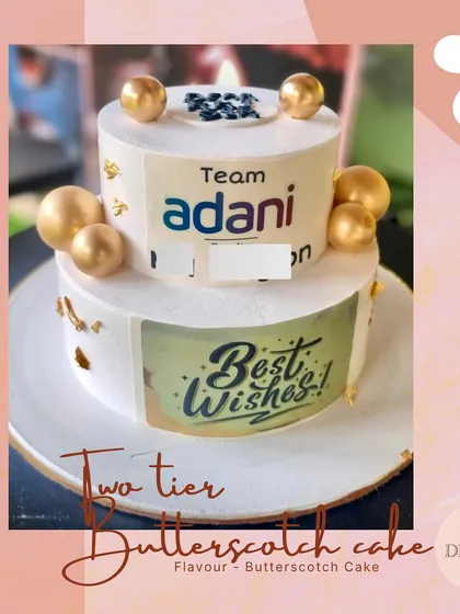 I create custom cakes that perfectly represent your brand for any corporate event. This two-tier butterscotch cake, designed for a celebration at Adani, is a great example of how I can incorporate company branding into a delicious and professional dessert.