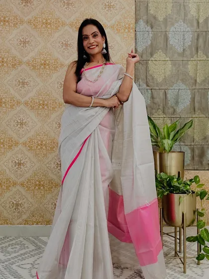 This grey and pink tissue saree is a modern and chic color combination. It's a great example of how budget-friendly sarees can look so stylish.