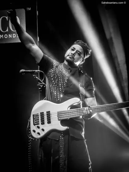 A powerful black and white shot of our bassist at the Senco Gold & Diamonds event. Our style and stage presence complement high-end brand events.