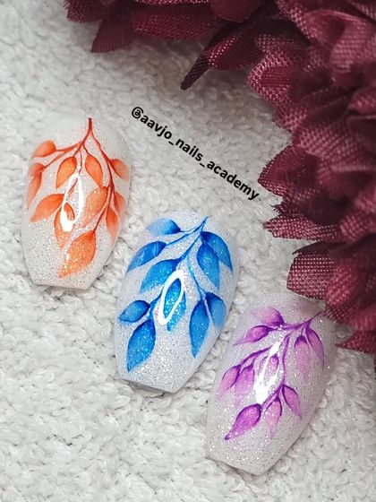 An example of Aquarelle nail art, which uses a watercolor technique to create soft, blended designs. I teach this advanced technique in my academy.