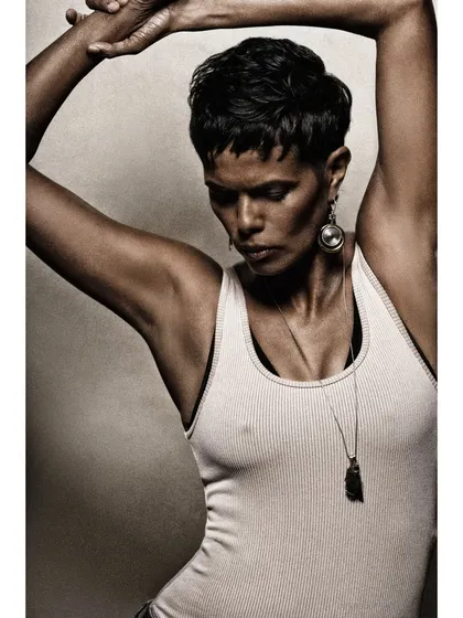 Can we stare at your poise? The incredible Tinu Verghis in a powerful, sculptural pose that highlights her strength and grace.