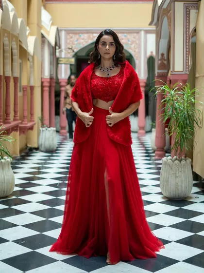 Get the glam look for a great deal. This red three-piece set features a thigh-high slit skirt, an embroidered crop top, and a faux fur shrug for a touch of old Hollywood glamour.