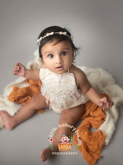 The weekend is here. This little sitter's curious expression is so cute. I love the simple setup with a soft blanket and a neutral background that keeps all the attention on her.