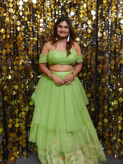 A fun and vibrant green two-piece outfit, perfect for a more casual or festive event.