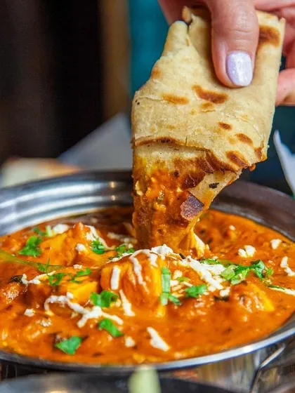 There's nothing like dipping a warm, soft roti into a creamy paneer curry. This is our Paneer Butter Masala, a crowd favourite, prepared with fresh paneer and a rich, flavourful tomato gravy.
