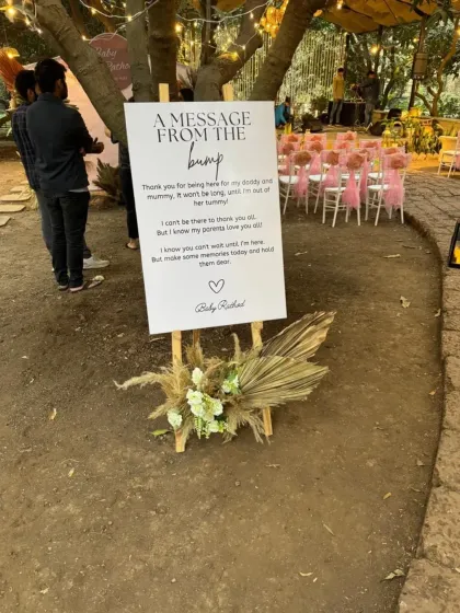 A sweet 'Message from the Bump' sign at a baby shower, a creative way to engage guests and add a personal touch to the celebration.