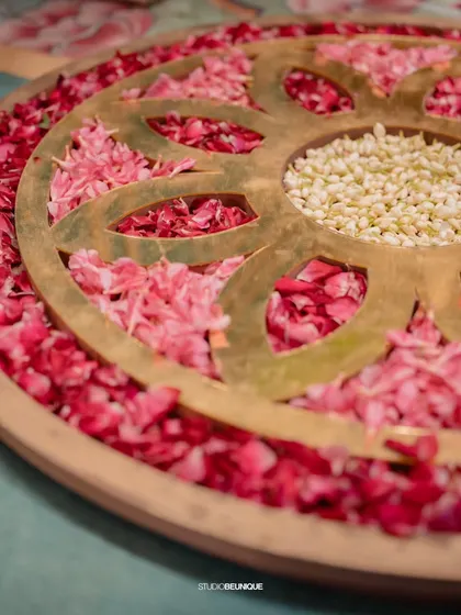 A close-up of a floral rangoli, a beautiful and traditional element that adds color and artistry to the floor space.