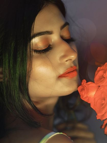 An intimate and romantic close-up. The warm glow on her skin and the soft focus create a dreamy and captivating image.