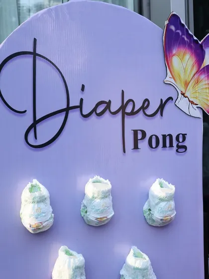 Diaper Pong! A hilarious and on-theme game that is always a huge hit at baby showers. It’s a playful activity that gets everyone involved and laughing.