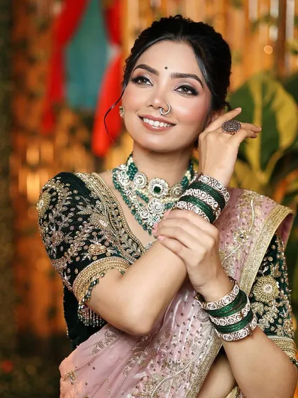 A playful and happy moment. The bride's glowing skin and perfectly matched lip color complete her stunning traditional ensemble.