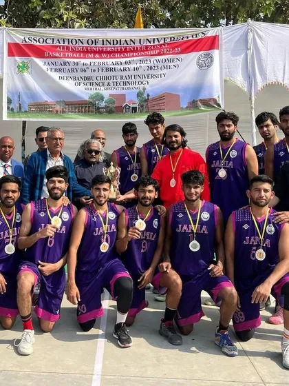 Victory tastes sweet. The Jamia basketball team celebrates their runner-up position at the All India University Basketball tournament held in Sonipat, Haryana.