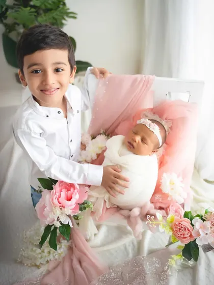 Welcoming a new baby is a magical time for the whole family. I love capturing the gentle curiosity and budding love of a big brother meeting his little sister for the first time.