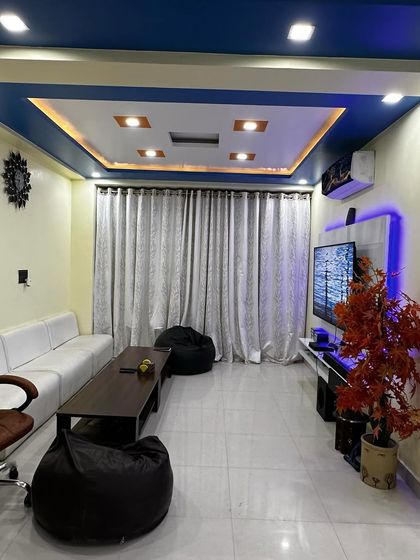 A view of the lounge area in our new office, complete with a comfortable sofa, bean bags, and a large screen, designed for team relaxation and informal meetings.