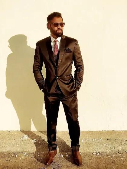 A three-piece suit look that means business. I believe in hustling hard and looking the part while doing it.