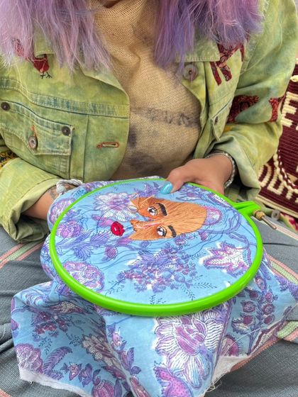 A participant in our garden embroidery workshop, focused on her intricate threadwork. Our collaborations bring a variety of textile arts to the studio.