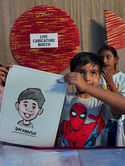 A boy in a Spiderman shirt with his caricature. I can even incorporate fun elements like favorite superheroes into the drawing.