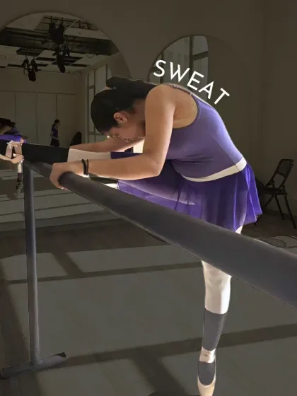 Sweat. A dancer stretches over the barre, showing the hard work and dedication required to achieve flexibility. There are no shortcuts in ballet.