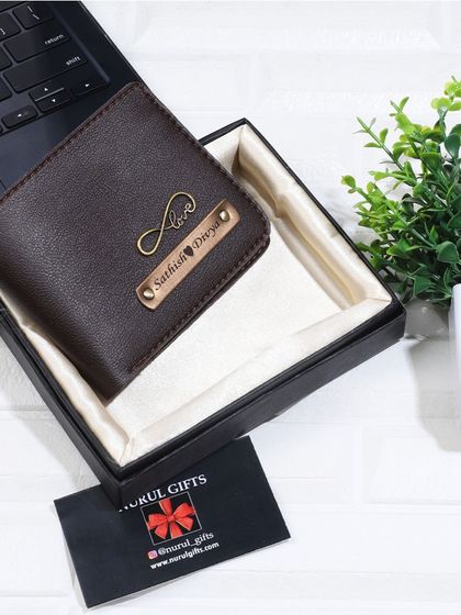 This brown leather wallet is personalized with an infinity 'Love' charm, symbolizing endless affection.
