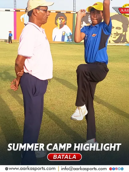 A coach and student work on bowling action during the summer camp. This one-on-one attention is key to our coaching philosophy.