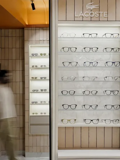 The motion of a person walking past adds a dynamic quality, illustrating the flow and circulation within the retail space.