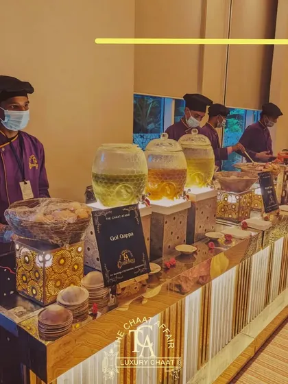 Our Gol Gappa station is always the center of attention. Here you can see our elegant, well-lit counter where our expert staff serves guests with a variety of flavored waters, ensuring every bite is a perfect explosion of authentic Dilli street food flavor.